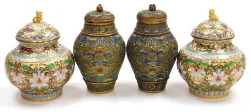 A pair of 20thC Chinese cloisonne jars and covers, decorated with peonies, on a gold ground,...