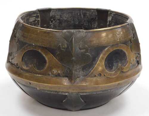 A 19thC Indian wooden and brass sherpai, or kunke, from the Bengal, the wooden shaped measuring...