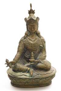A Tibetan brass figure of Padmasambhava, modelled seated on a lotus flower base, 22cm high,... - 7