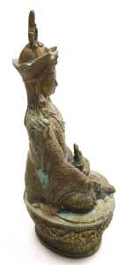 A Tibetan brass figure of Padmasambhava, modelled seated on a lotus flower base, 22cm high,... - 10