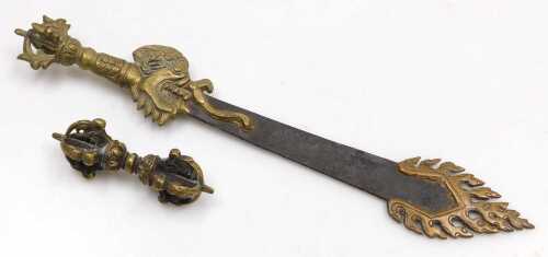 A Tibetan Buddhist flaming sword of wisdom, with a brass dragon handle, and flame like tip, with...