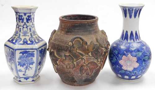 Two late 20thC Chinese blue and white porcelain vases, 36cm high, together with a rustic...