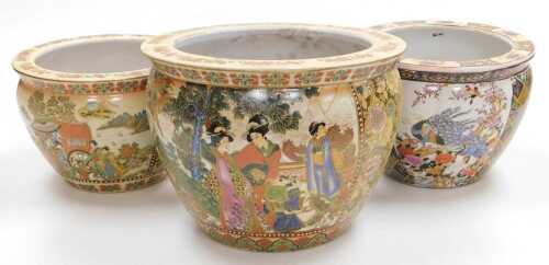 A pair of late 20thC Chinese Satsuma style pottery graduated goldfish bowls, decorated with...