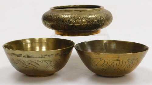 A Chinese bronze bowl, embossed with dragons chasing a flaming pearl, apocryphal Xuande six...