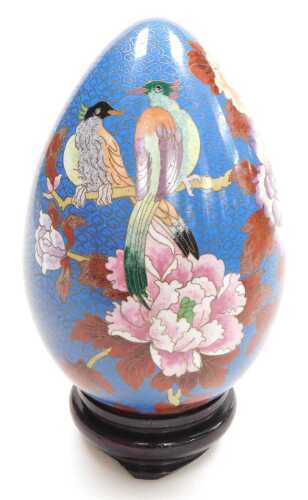 A late 20thC Chinese cloisonne enamel egg, on stand, decorated with birds on a bough with...