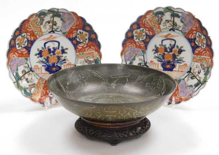 A pair of Meiji period Japanese Imari dishes, of fluted form, decorated with reserves of cranes...