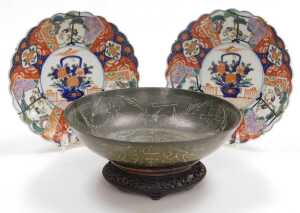 A pair of Meiji period Japanese Imari dishes, of fluted form, decorated with reserves of cranes...