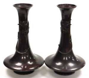 A pair of Japanese Meiji period bronze vases, of trumpet form, the neck entwined in relief with...
