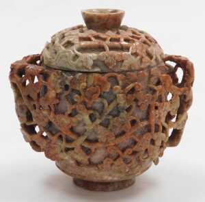 A 20thC Chinese soapstone pot and cover, of twin handled form, carved in relief with vines, 17cm... - 2