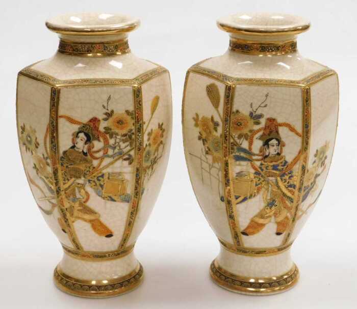 A pair of early 20thC Japanese Satsuma vases, of hexagonal baluster form, decorated with figures...