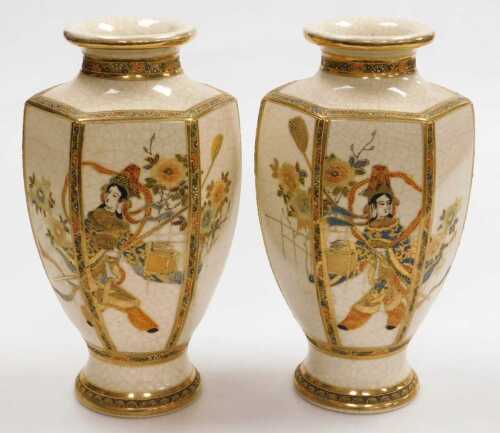 A pair of early 20thC Japanese Satsuma vases, of hexagonal baluster form, decorated with figures...