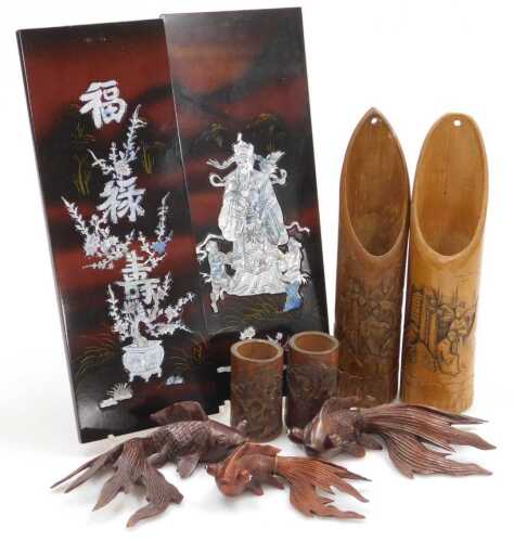 Three 20thC Chinese hardwood carvings of fantail goldfish, together with two pairs of carved...