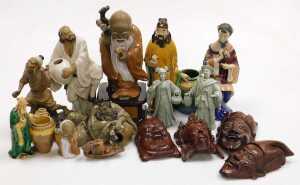 A group of 20thC Chinese Shiwan pottery mudman figures, including a seated lady, and deities,...