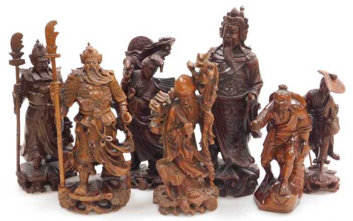 A group of 19thC and later Chinese hardwood figures, including Guanyin, Guan Yu, Shou Lao, and...