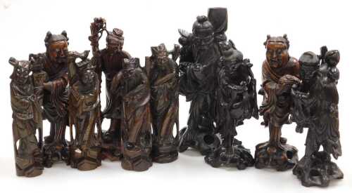 A group of late 19th and later Chinese hardwood figures, chiefly of emperors or deities, largest...