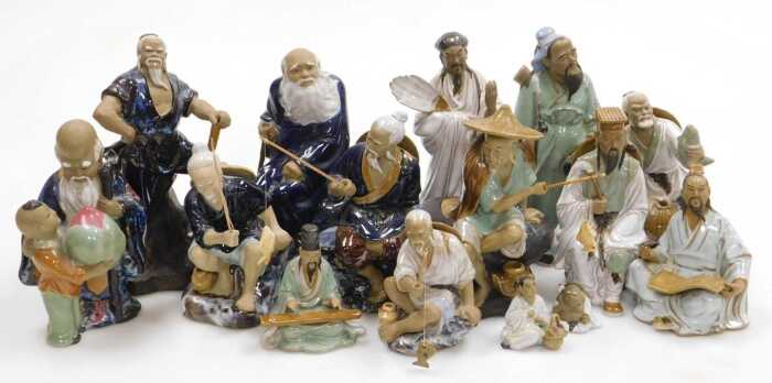 A group of 20thC Chinese Shiwan mudman figures, including fishermen, a deity with a child,...