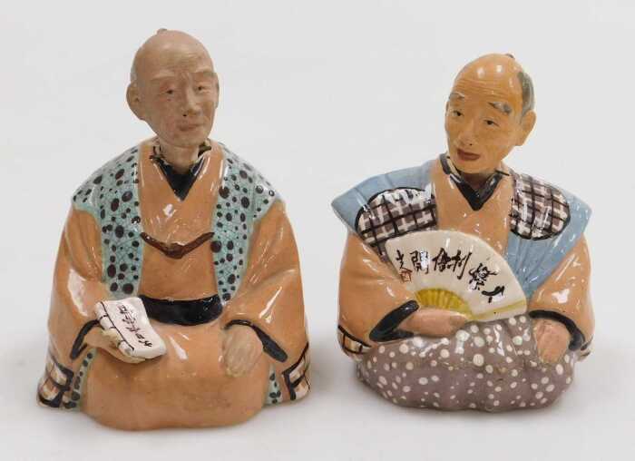 A pair of 20thC Japanese pottery nodding hakata dolls.