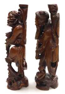 Two late 19thC Chinese hardwood figural carved table lamps, lacking fitments, both carved as... - 2