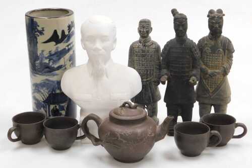 A Vietnamese plaster bust of Ho Chi Minh, a blue and white pottery cylindrical vase decorated...