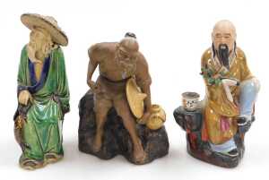 A group of 20thC Chinese Shiwan mudman figures, including two men seated playing a board game,... - 18