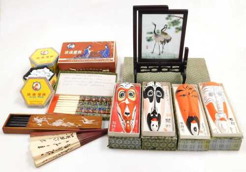 Four Chinese pottery opera masks, a set of cloisonne chopsticks, a table screen, paper fan, etc....