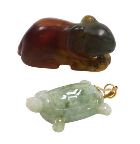 A Chinese jade pendant, modelled as a terrapin, 3cm high, together with an amber carving of a...