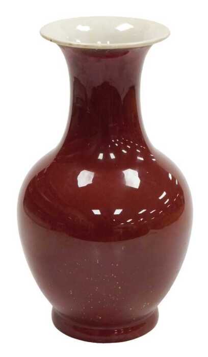 A 19thC Chinese sang-de-boeuf porcelain vase, of baluster form with an everted neck, 32cm high.