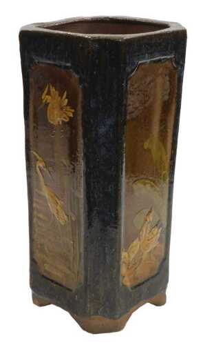 An early 20thC Chinese or Japanesevase, of canted square form, relief decorated with panels of...