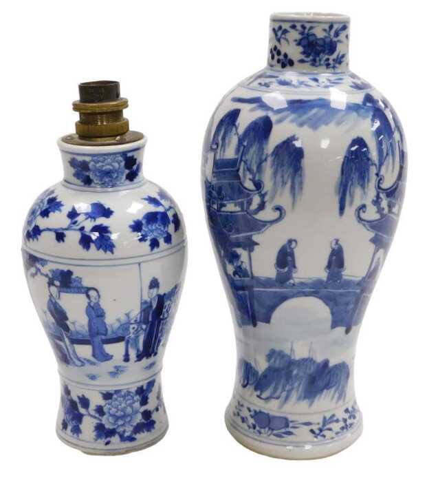 A Chinese Kangxi style porcelain blue and white vase, of baluster form, decorated with figures...