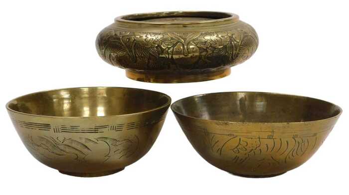 A Chinese bronze incense burner, embossed with dragons chasing a flaming pearl, apocryphal...
