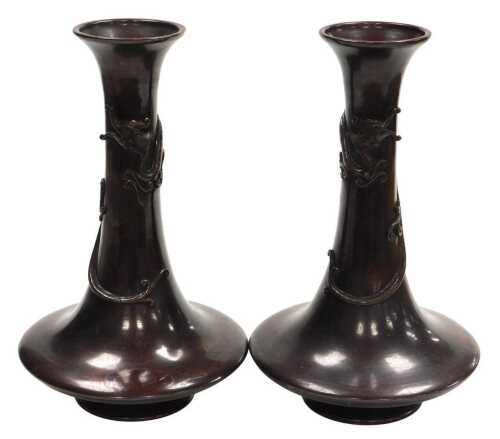 A pair of Japanese Meiji period bronze vases, of trumpet form, the neck entwined in relief with...