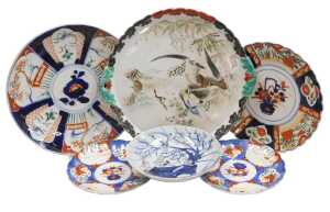 A Chinese Qing Dynasty blue, white and red porcelain dish, decorated with stylised birds on a...