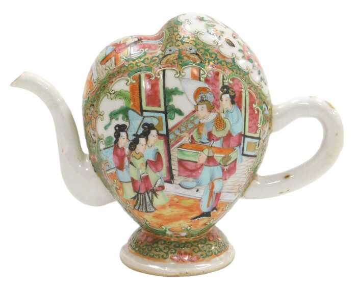 A Qing Dynasty Chinese Cantonese porcelain Cadogan teapot, decorated with reserves of figures in...