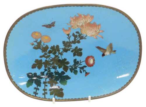 A Meiji period Japanese oval cloisonne dish, decorated with a bird, butterfly, and...
