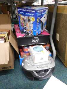 Electrical items to include a portable CD player, a Cool-Down fan, together with various jigsaws...
