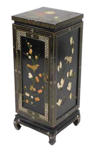 A Chinese black lacquered cupboard, decorated with flowers, the sides overlaid in Mother of...