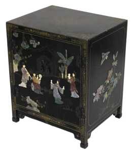 A Chinese black lacquered cupboard, of rectangular form, with floral and foliate scroll...