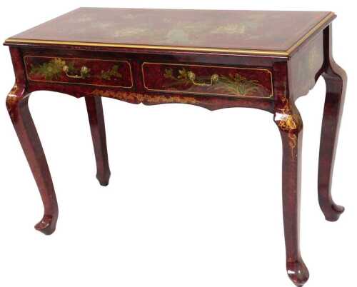 A Chinese red and black lacquer side table, with two frieze drawers, decorated with birds and...