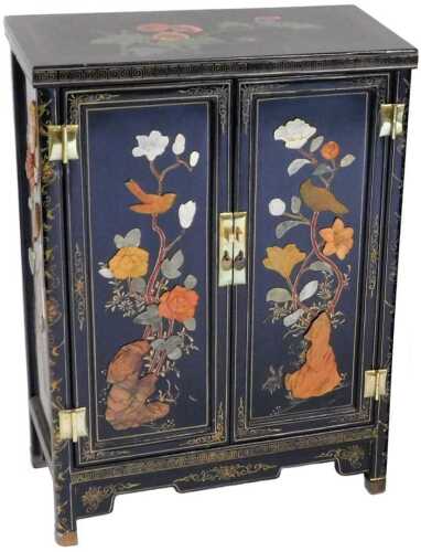 A Chinese black lacquer cabinet, of rectangular form, decorated with flowers, and overlaid in...