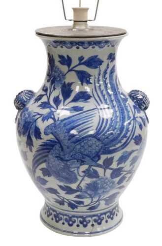 A Chinese Qing Dynasty 19thC blue and white porcelain vase, of baluster form, with butterfly and...