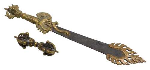 A Tibetan Buddhist flaming sword of wisdom, with a brass dragon handle, and flame like tip, with...