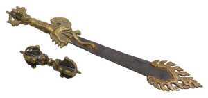 A Tibetan Buddhist flaming sword of wisdom, with a brass dragon handle, and flame like tip, with...