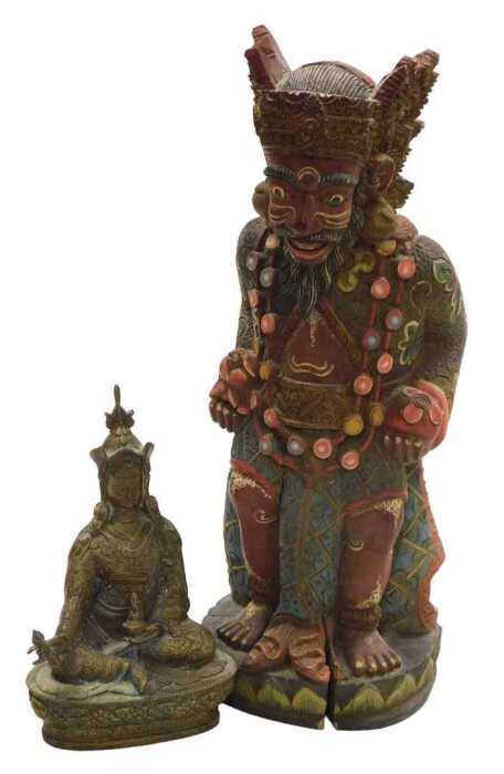 A Tibetan brass figure of Padmasambhava, modelled seated on a lotus flower base, 22cm high,...