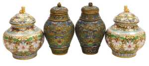 A pair of 20thC Chinese cloisonne jars and covers, decorated with peonies, on a gold ground,...
