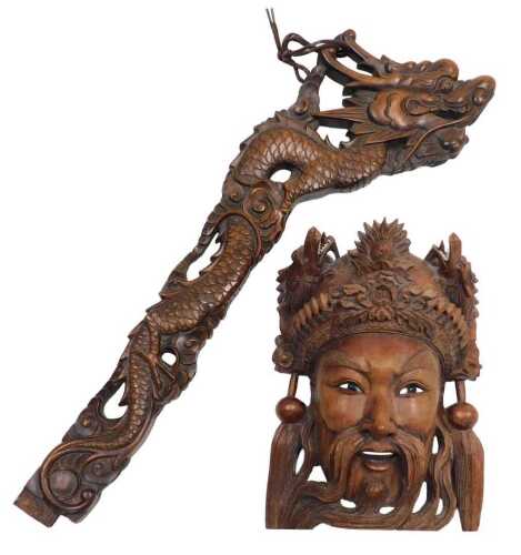 An early 20thC Chinese carved hardwood standard lamp arm, carved as a dragon, 61cm high,...