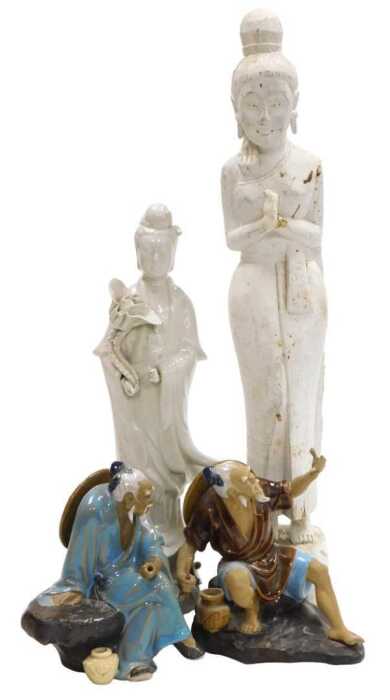 A 20thC Chinese blanc de chine figure of Guanyin, modelled standing holding a lotus flower, 37cm...
