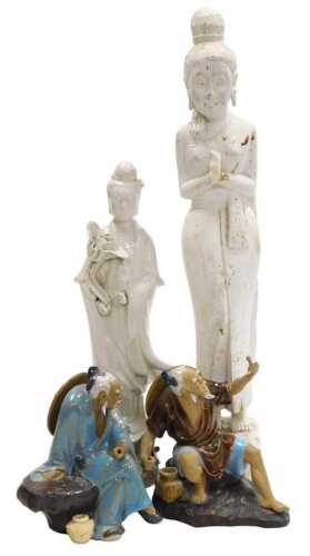 A 20thC Chinese blanc de chine figure of Guanyin, modelled standing holding a lotus flower, 37cm...