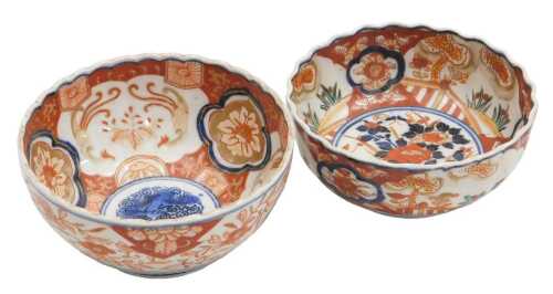 A Japanese Meiji period Imari porcelain bowl, of fluted form, decorated with reserves of hoho...
