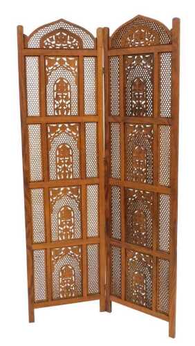 An Eastern hardwood two fold screen, with fretwork paneling and carved decoration of trees in...
