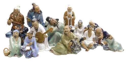 Assorted Chinese Shiwan mudman figures, including a sitar player, fisherman, street sellers, etc....
